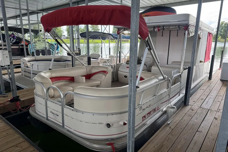 The Image of 2008 Sun Tracker Party Hut 30 I/O Regency Edition pontoon boat docked under a canopy. - 1