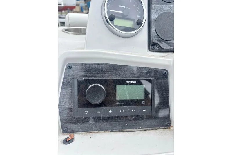 Slide: The Image of Control panel of 2024 Avalon VLS Quad Lounge boat with Fusion audio system. - 8