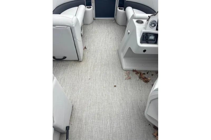 Slide: The Image of 2024 Avalon VLS Quad Lounge interior with beige flooring and white seating. - 9