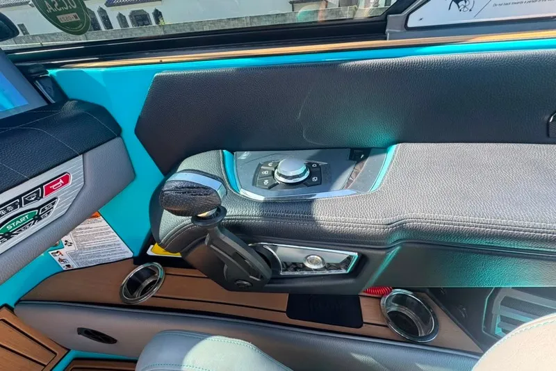 Slide: The Image of Interior controls of a 2022 Nautique Super Air Nautique G23 boat cockpit. - 81