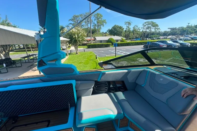 Slide: The Image of Interior of 2022 Nautique Super Air Nautique G23 boat, featuring modern seating and design. - 65