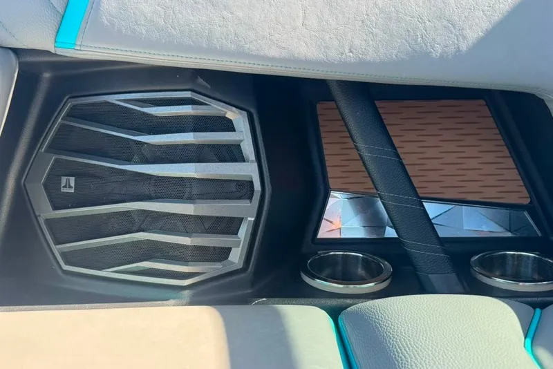 Slide: The Image of 2022 Nautique Super Air Nautique G23 interior speaker and cup holders. - 72