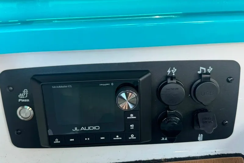 Slide: The Image of Control panel of 2022 Nautique Super Air Nautique G23 with JL Audio system and USB ports. - 42