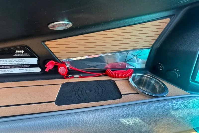 Slide: The Image of Interior detail of 2022 Nautique Super Air Nautique G23 boat dashboard. - 77