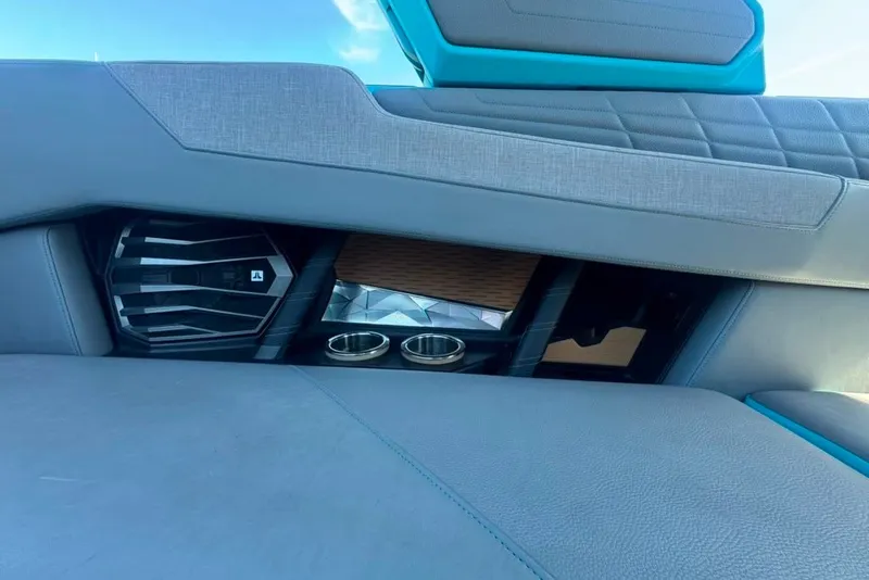 Slide: The Image of Interior of 2022 Nautique Super Air Nautique G23 with speaker and cup holders. - 33