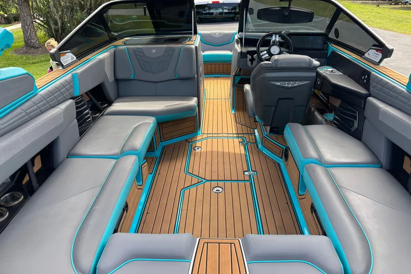 Slide: The Image of 2022 Nautique Super Air Nautique G23 interior with luxurious seating and modern design. - 26