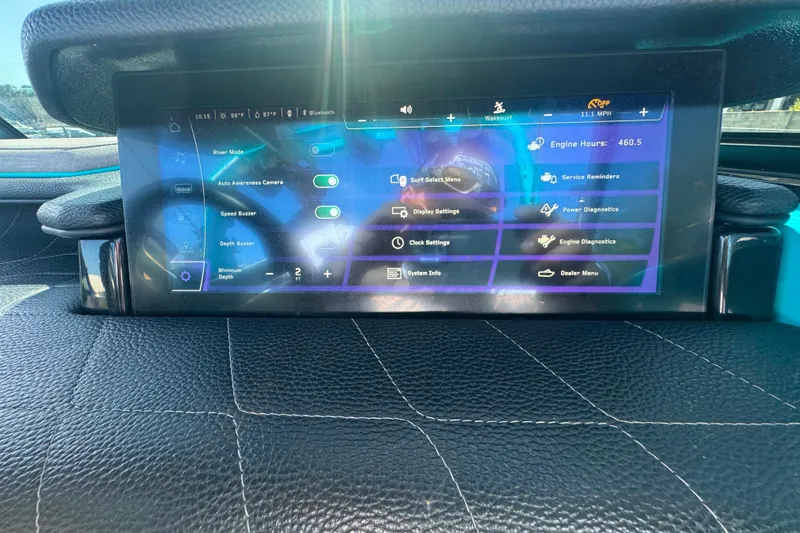 Slide: The Image of 2022 Nautique Super Air Nautique G23 dashboard display with various control settings and diagnostics. - 64
