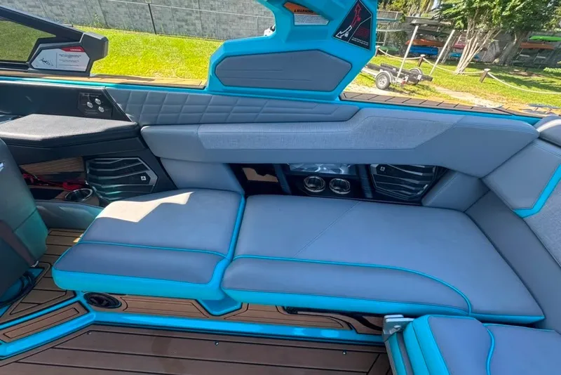 Slide: The Image of 2022 Nautique Super Air Nautique G23 interior with gray and blue seating. - 41