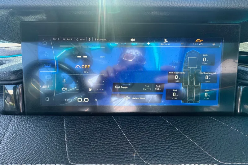 Slide: The Image of Dashboard display of a 2022 Nautique Super Air Nautique G23 boat. - 49