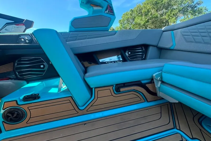 Slide: The Image of 2022 Nautique Super Air Nautique G23 interior with blue and gray seating, modern design. - 103