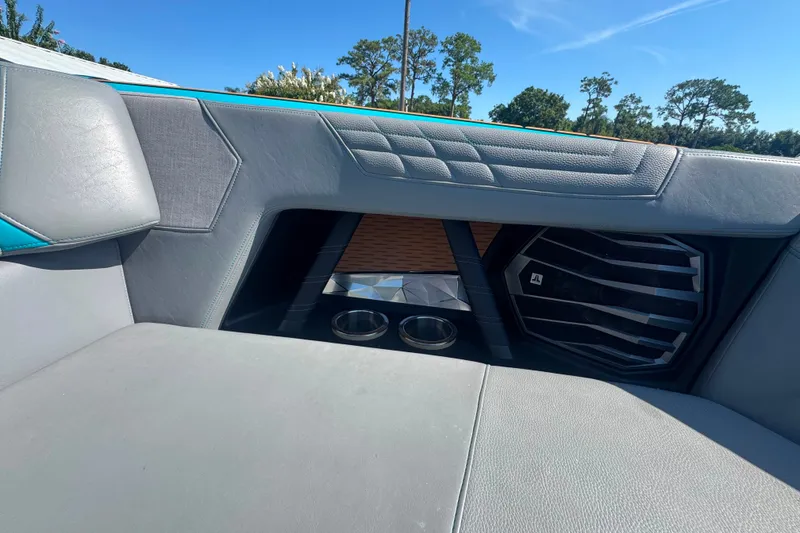 Slide: The Image of Interior of 2022 Nautique Super Air Nautique G23 with speaker and cup holders. - 43