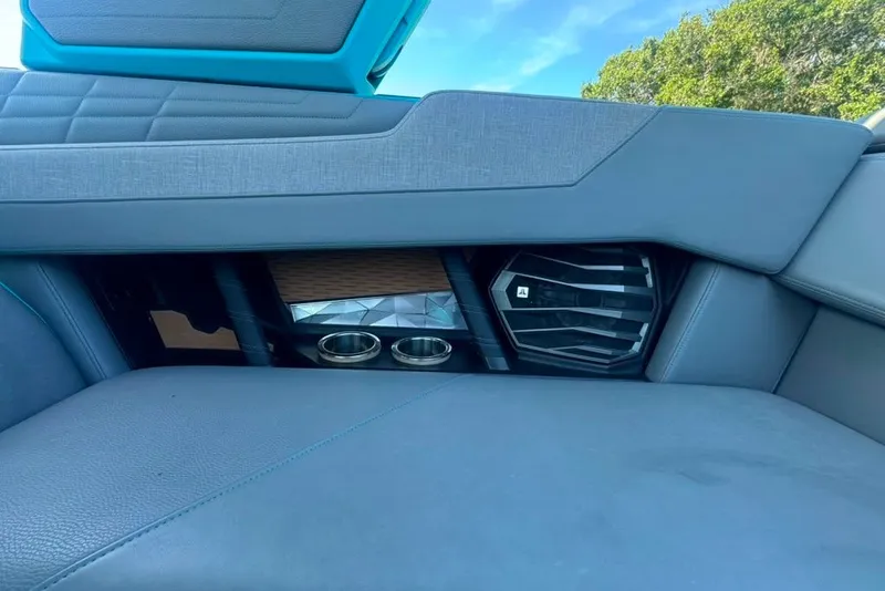 Slide: The Image of Interior of 2022 Nautique Super Air Nautique G23 with speaker and cup holders. - 114