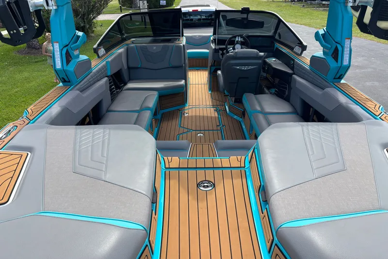 Slide: The Image of 2022 Nautique Super Air Nautique G23 interior with sleek seating and modern design. - 25