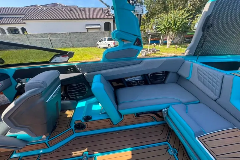 Slide: The Image of Interior of 2022 Nautique Super Air Nautique G23 boat with blue and gray seating. - 47