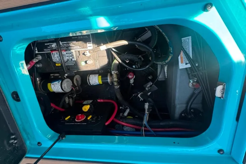 Slide: The Image of Engine compartment of 2022 Nautique Super Air Nautique G23, showing battery and wiring. - 74