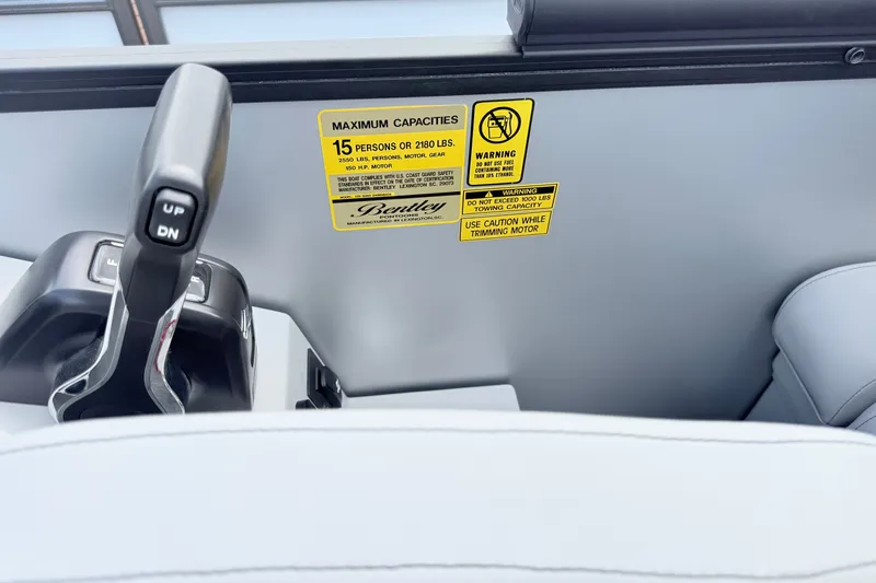 Slide: The Image of Control panel of 2027 Bentley Pontoons LEGACY 220 QSB with capacity warning label. - 14