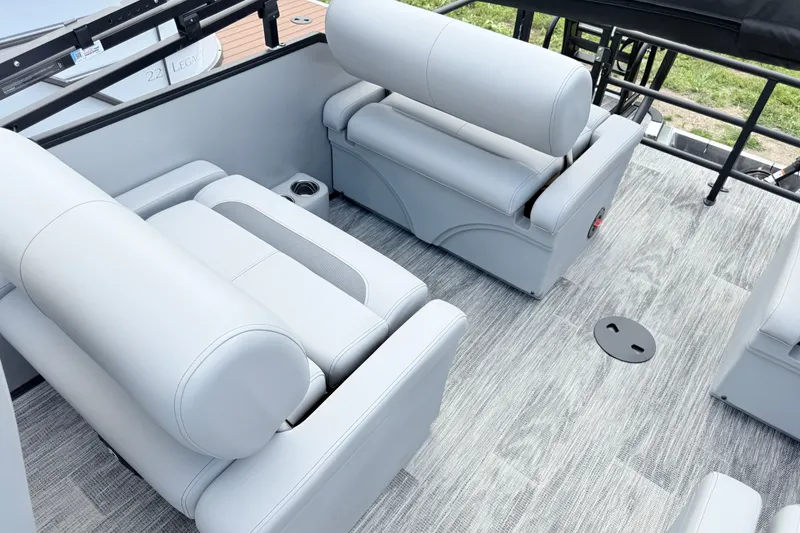 Slide: The Image of 2027 Bentley Pontoons LEGACY 220 QSB interior with luxurious seating and modern flooring. - 16
