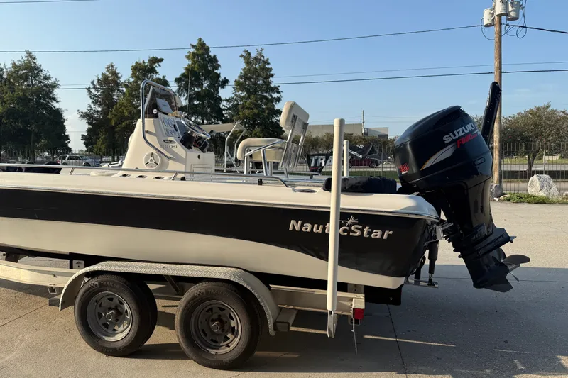 Slide: The Image of 2007 NauticStar 2200 NauticBay boat on trailer with Suzuki outboard motor. - 7