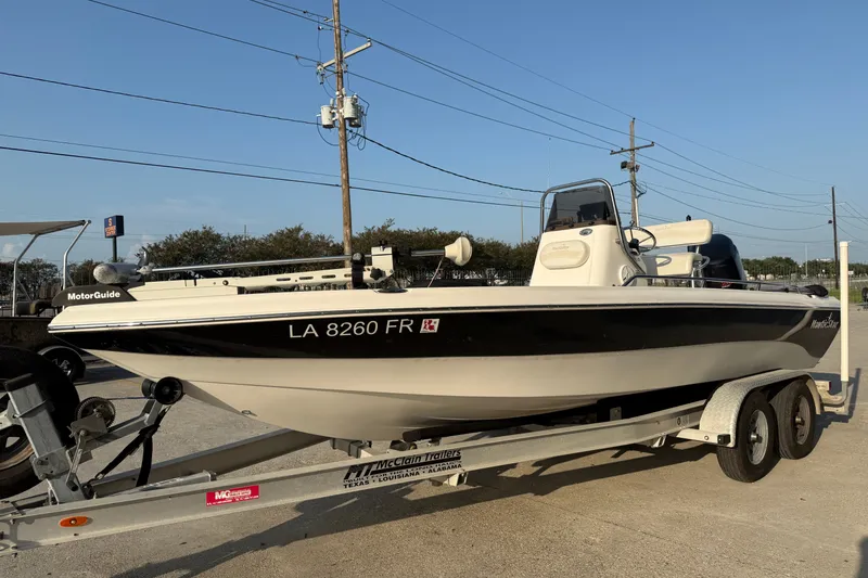 Slide: The Image of 2007 NauticStar 2200 NauticBay boat on trailer, parked outdoors. - 4
