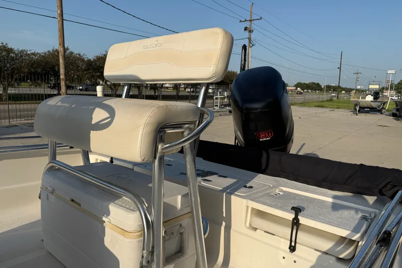 Slide: The Image of 2007 NauticStar 2200 NauticBay boat interior with seating and Suzuki 250 engine. - 10