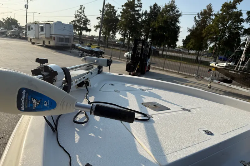 Slide: The Image of 2007 NauticStar 2200 NauticBay boat with MotorGuide trolling motor in a marina setting. - 12