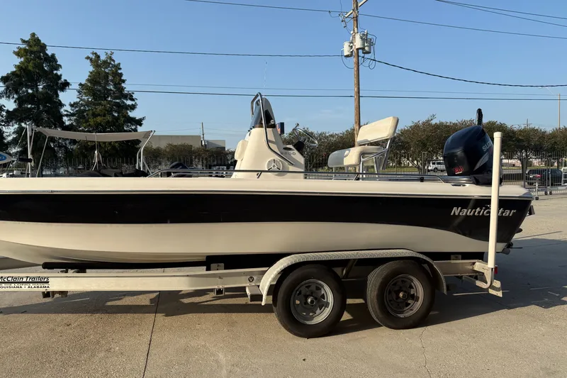 Slide: The Image of 2007 NauticStar 2200 NauticBay boat on trailer, side view, outdoors. - 6