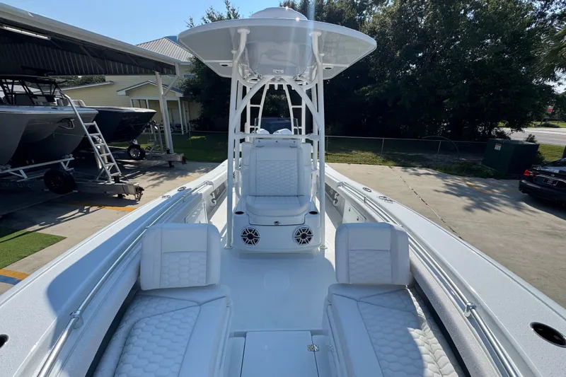 Slide: The Image of 2027 Yellowfin 26 Hybrid boat with sleek white seating and modern design. - 23