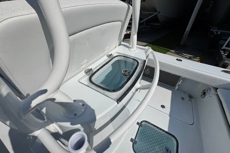 Slide: The Image of 2027 Yellowfin 26 Hybrid boat interior with livewell and seating area. - 38