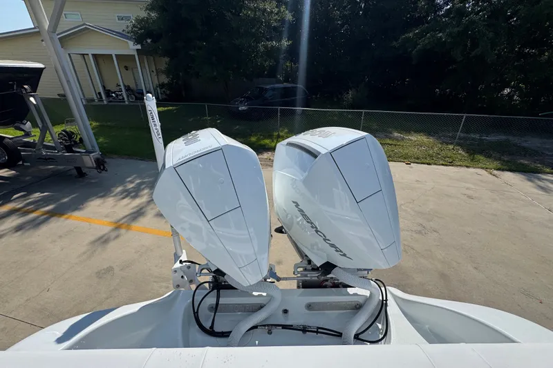 Slide: The Image of 2027 Yellowfin 26 Hybrid boat with dual Mercury outboard engines in a driveway. - 41