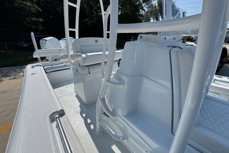 Slide: The Image of 2027 Yellowfin 26 Hybrid boat interior with sleek white seating and modern design. - 27