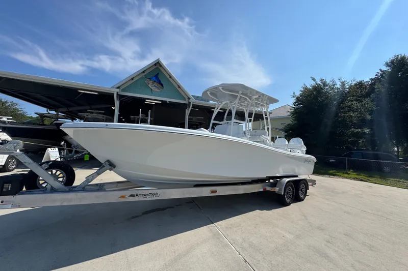 Slide: The Image of 2027 Yellowfin 26 Hybrid boat on trailer under clear blue sky. - 3