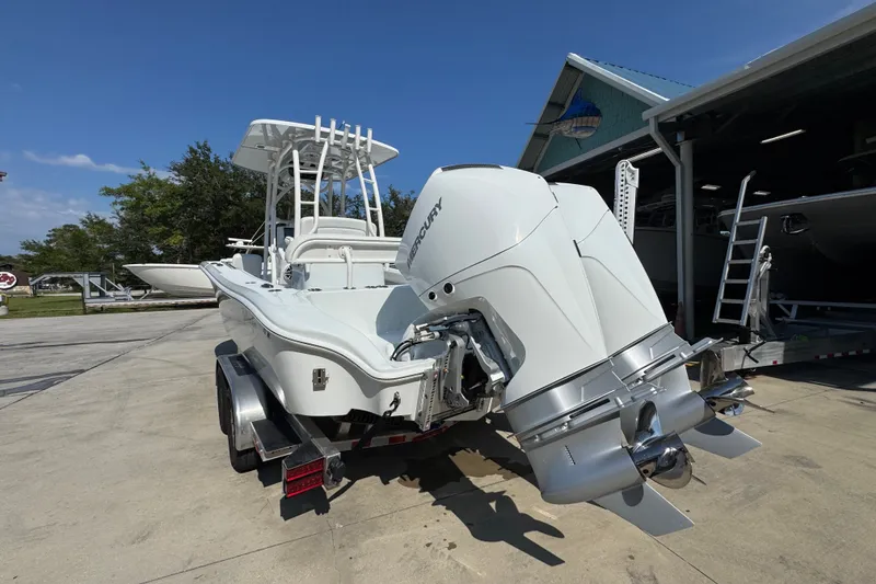 Slide: The Image of 2027 Yellowfin 26 Hybrid boat with dual Mercury engines on a trailer. - 15