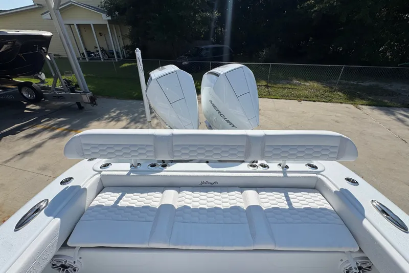Slide: The Image of 2027 Yellowfin 26 Hybrid boat with dual Mercury engines, featuring luxurious white seating. - 40