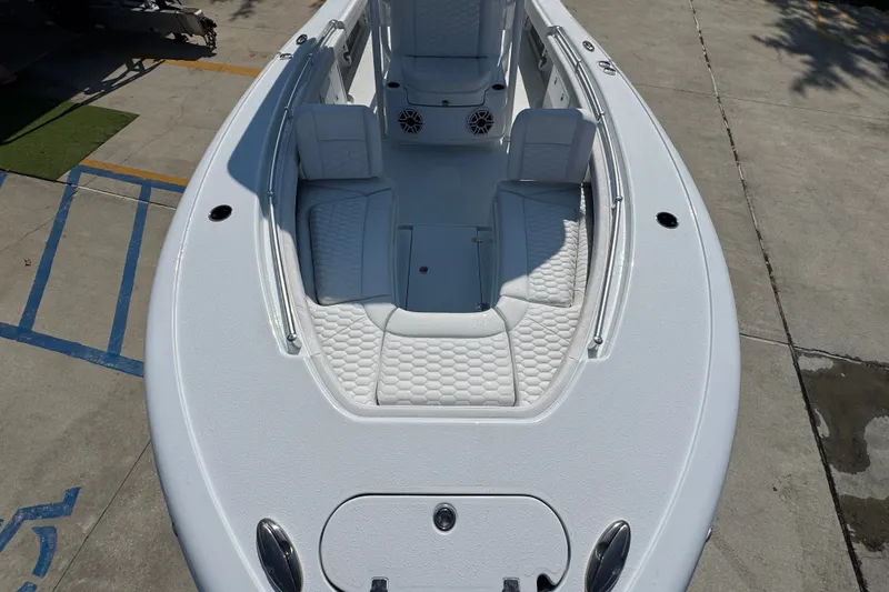 Slide: The Image of 2027 Yellowfin 26 Hybrid boat with white seating and spacious deck layout. - 21