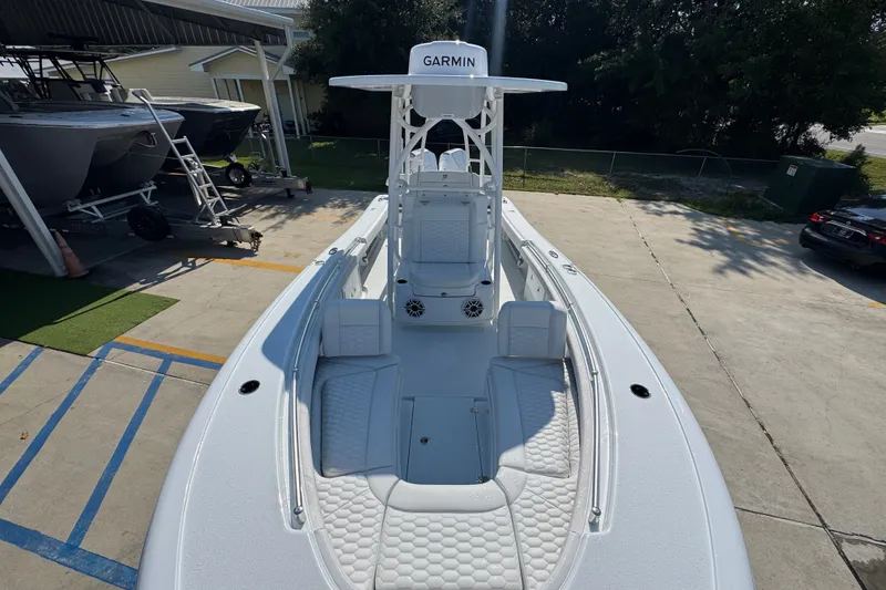 Slide: The Image of 2027 Yellowfin 26 Hybrid boat with Garmin equipment, docked in a marina. - 22