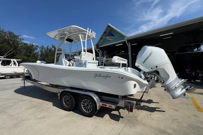 Slide: The Image of 2027 Yellowfin 26 Hybrid boat on trailer with Mercury outboard engine. - 17
