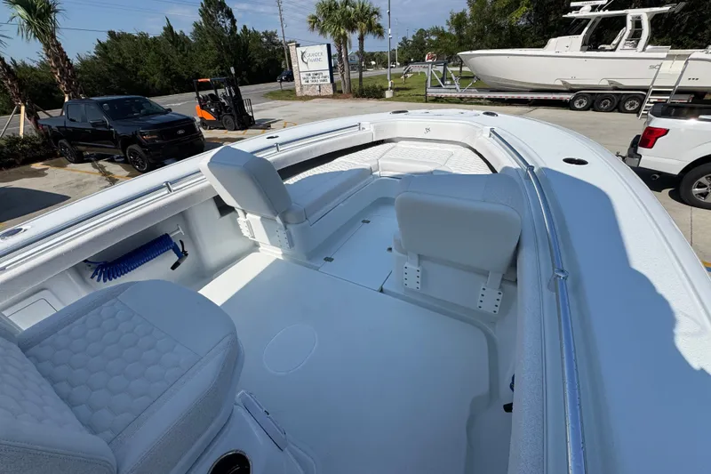 Slide: The Image of 2027 Yellowfin 26 Hybrid boat interior with seating and storage compartments. - 18