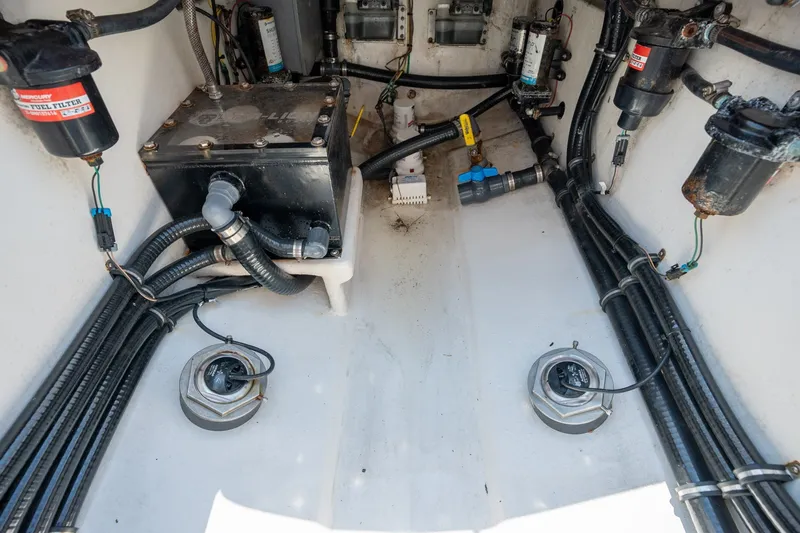 Slide: The Image of Engine compartment of 2022 Sea-Lion 34 TE boat with fuel filters and wiring. - 45