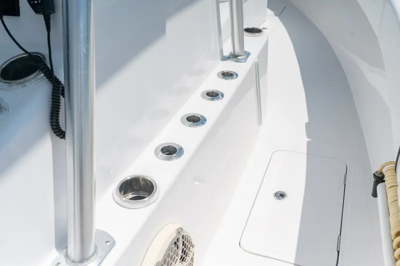 Slide: The Image of Interior view of 2022 Sea-Lion 34 TE boat, featuring rod holders and storage compartment. - 21