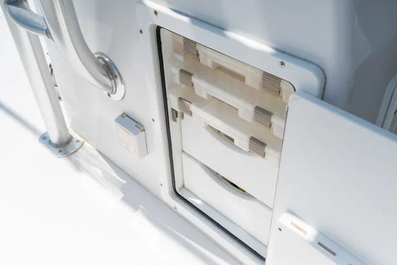 Slide: The Image of Storage compartment on a 2022 Sea-Lion 34 TE boat, featuring organized drawers. - 25