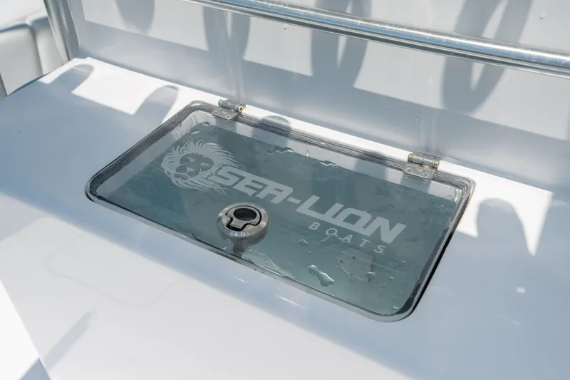 Slide: The Image of 2022 Sea-Lion 34 TE boat compartment with logo on glass cover. - 40