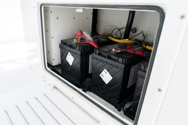 Slide: The Image of Battery compartment of 2022 Sea-Lion 34 TE boat, featuring multiple connected batteries. - 43
