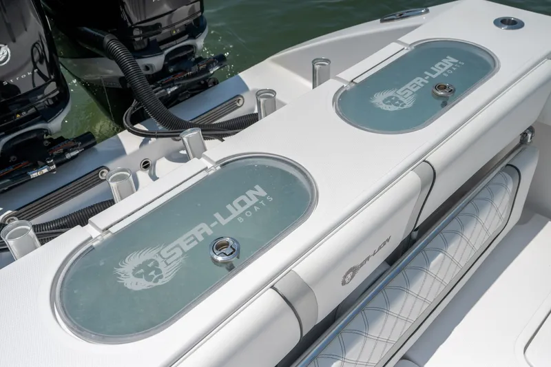 Slide: The Image of 2022 Sea-Lion 34 TE boat with dual engines and branded livewell covers. - 39