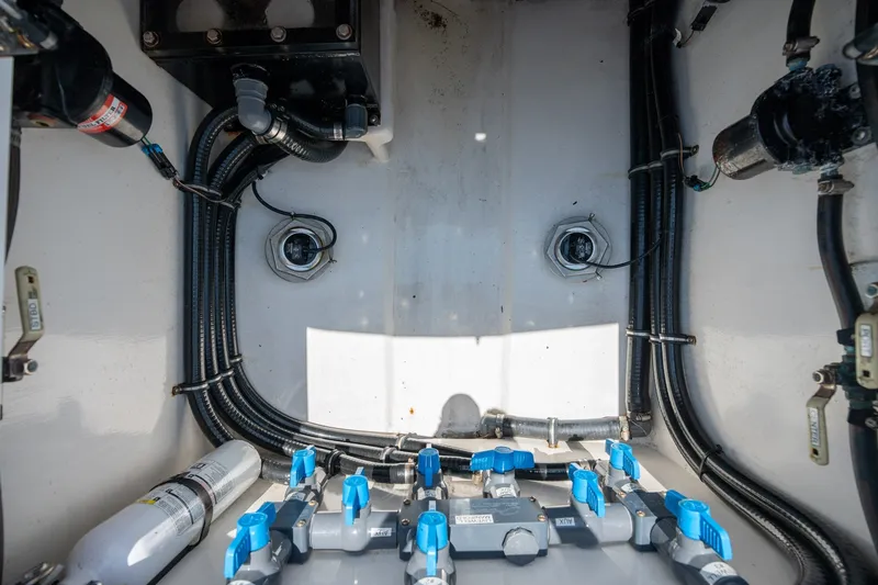 Slide: The Image of Engine compartment of 2022 Sea-Lion 34 TE boat, showcasing wiring and plumbing systems. - 44