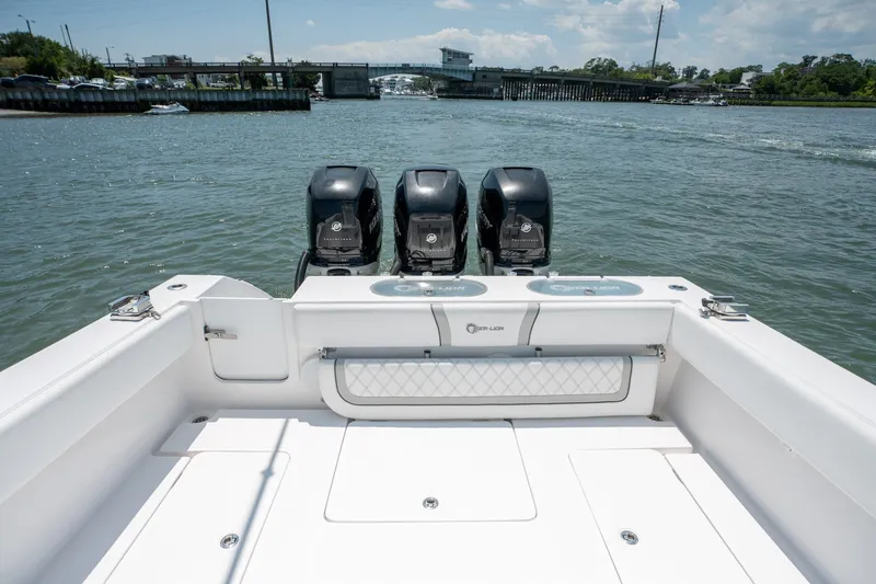 Slide: The Image of 2022 Sea-Lion 34 TE boat with triple outboard engines on a sunny day. - 38