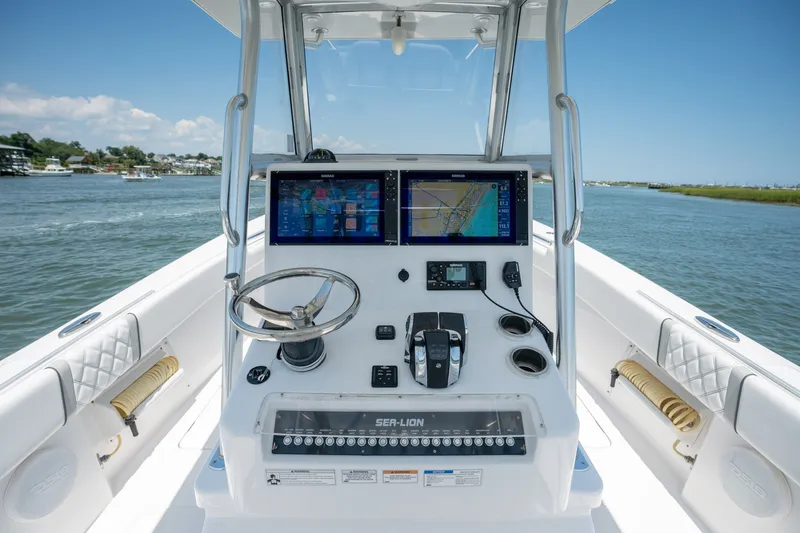 Slide: The Image of Center console of 2022 Sea-Lion 34 TE boat with navigation screens and controls. - 29