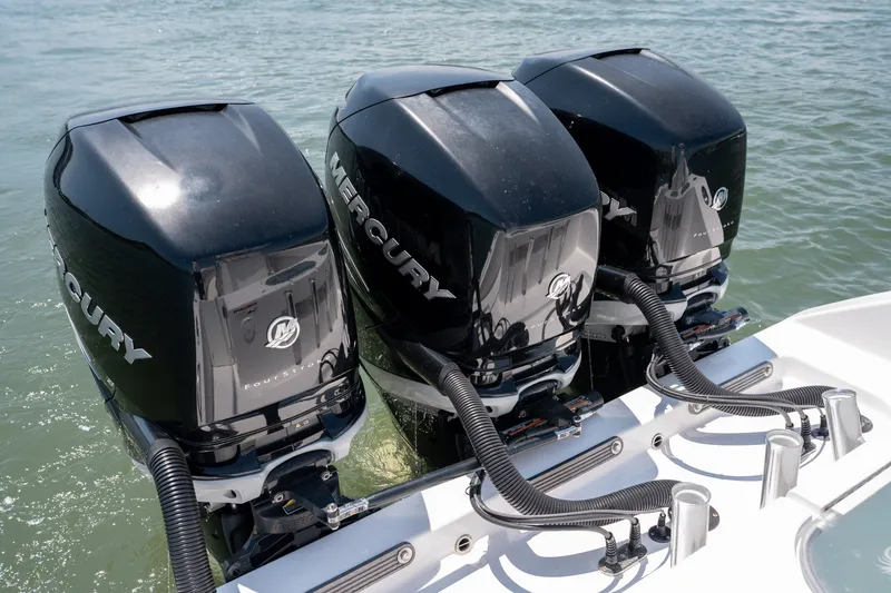 Slide: The Image of Triple Mercury outboard engines on a 2022 Sea-Lion 34 TE boat in water. - 42