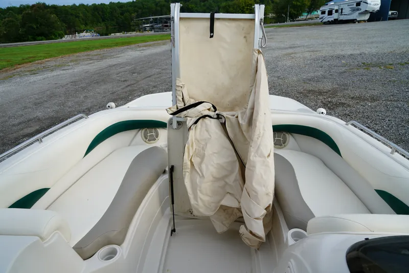 Slide: The Image of 2007 Tahoe 215 I/O boat interior with white seating and green accents. - 25