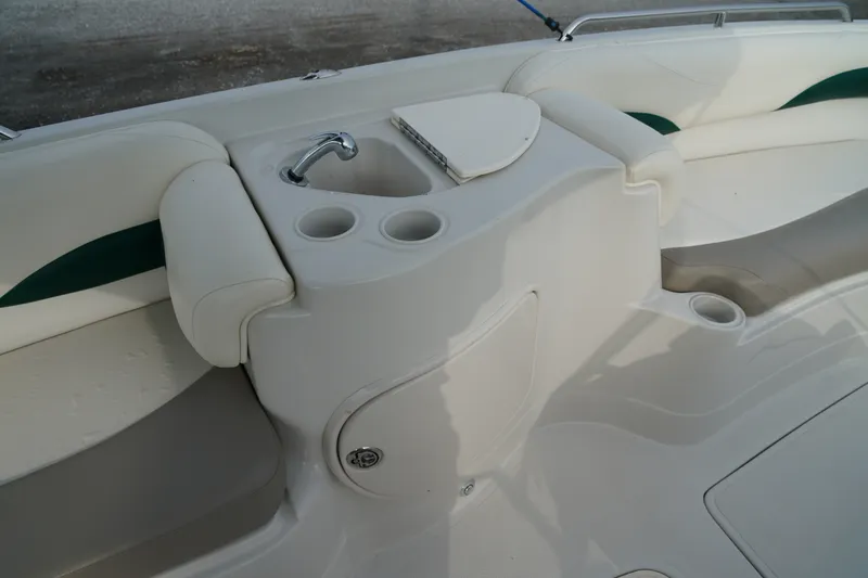 Slide: The Image of 2007 Tahoe 215 I/O boat interior with sink and cup holders. - 19
