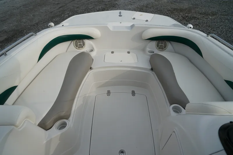 Slide: The Image of 2007 Tahoe 215 I/O boat interior with white and gray seating, cup holders, and speakers. - 20
